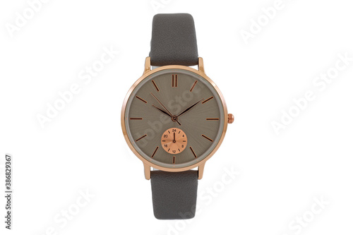 Classic fashion gold wristwatch with gray leather strap and brown dial face, isolated on white background.