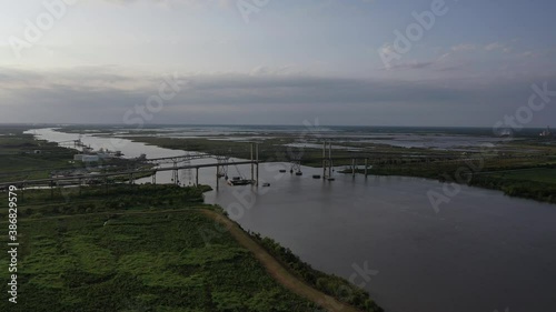 Wallpaper Mural Twin bridge over a busy shipping channel near Bridge City Texas during a sunset Torontodigital.ca