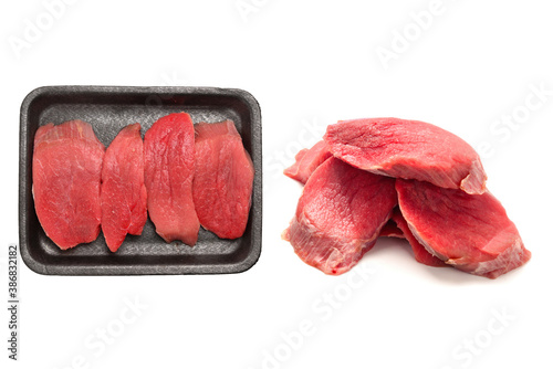 Raw veal in container isolated on white background.
