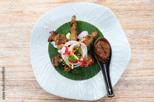 Chicken Satay on dark brown table street food appetizer