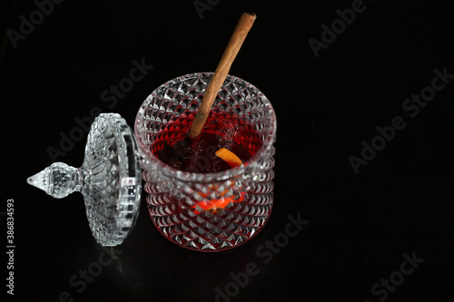 Pink Cocktail glass with ice at a bar counter