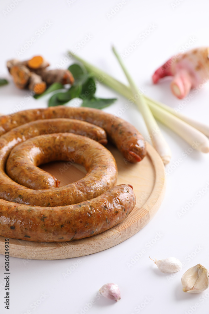 Fototapeta premium Local Northern Thai food , Northern Thai spicy sausage street food isolated in white background