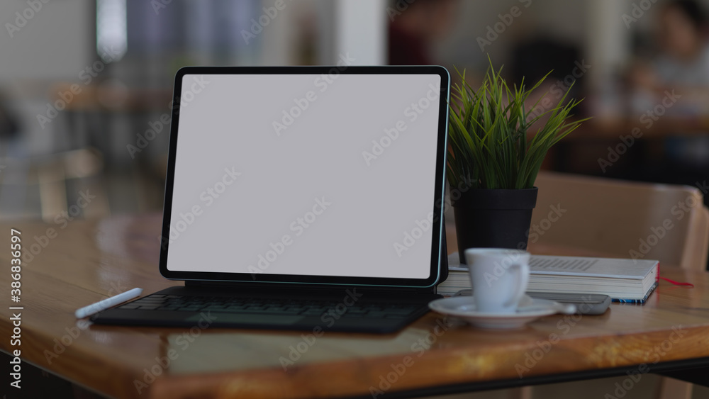 Fototapeta premium Digital tablet include clipping path on wooden table in home office room