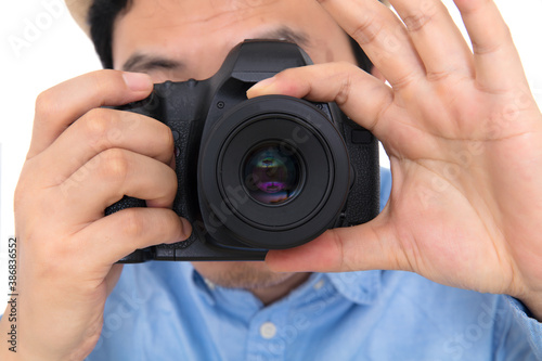 Close-up of professional photographer while taking pictures