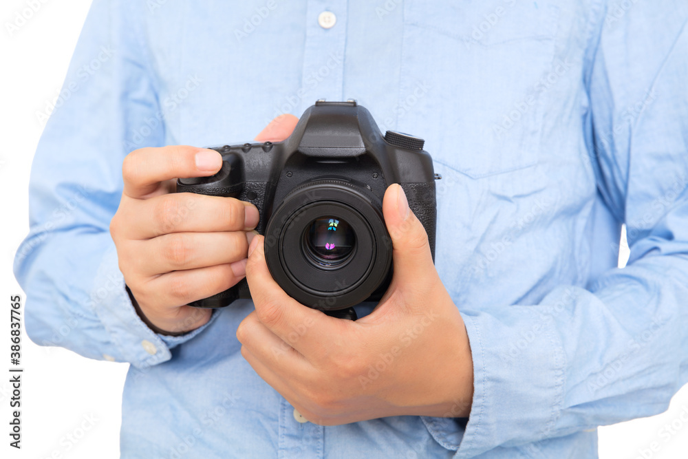 Close-up of photographer holding SLR camera in hand Close-up of photographer holding SLR camera in hand