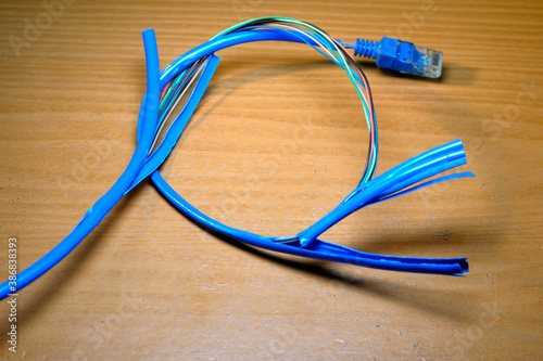  broken blue network cable chipped in a circular roll