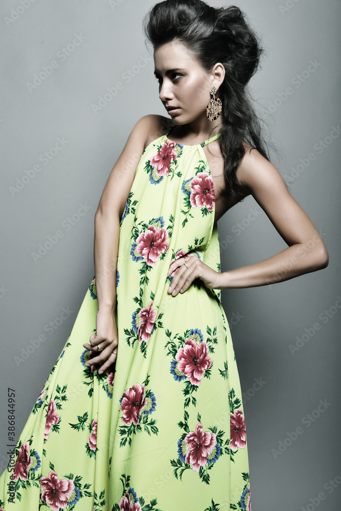 Fototapeta premium Fashion model in bright dress