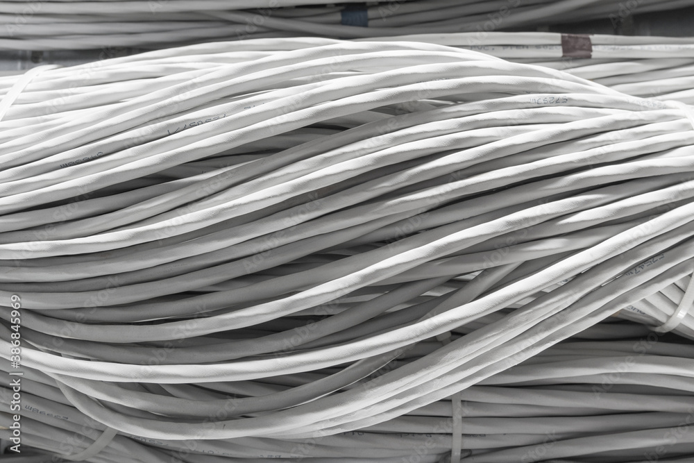 bunch of network cables in wave pattern in server room bunch of network cables in wave pattern in server room