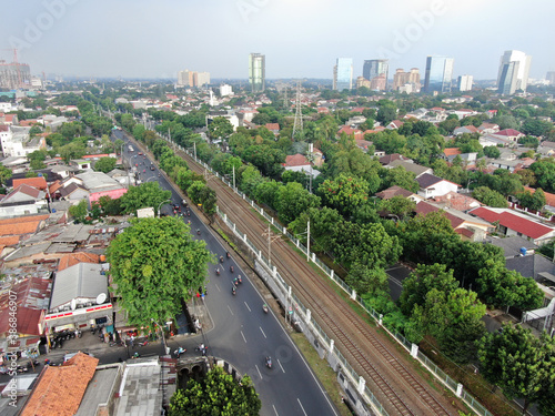 Aerial drone view of KRL commuter line Jabodetabek JR205 electric train near Pasar Minggu, Jakarta, Indonesia