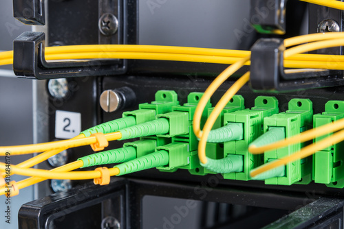 Fiber Optic cables connected to network switch © kubais