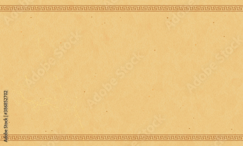 Antique papyrus paper with Greek ornaments. Marble background.