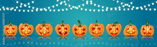 Halloween banner or website header with pumpins with cut out faces and hanging garlsnd on blue background. Vector illustration. photo
