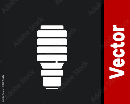 White LED light bulb icon isolated on black background. Economical LED illuminated lightbulb. Save energy lamp. Vector.