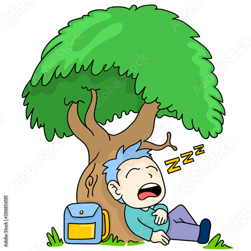 a male student sleeping under a tree