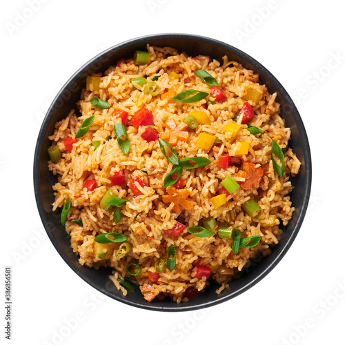 Veg Schezwan Fried Rice in black bowl isolated on white background. Vegetarian Szechuan Rice is indo-chinese cuisine dish with bell peppers, green beans, carrot. Top view