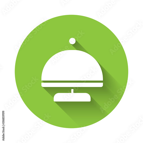 White Covered with a tray of food icon isolated with long shadow. Tray and lid sign. Restaurant cloche with lid. Green circle button. Vector.
