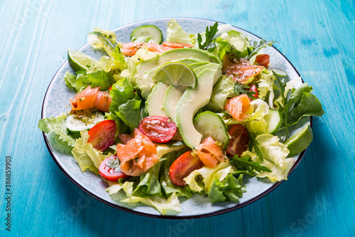 Healthy salad with smoked samlmon and avocado