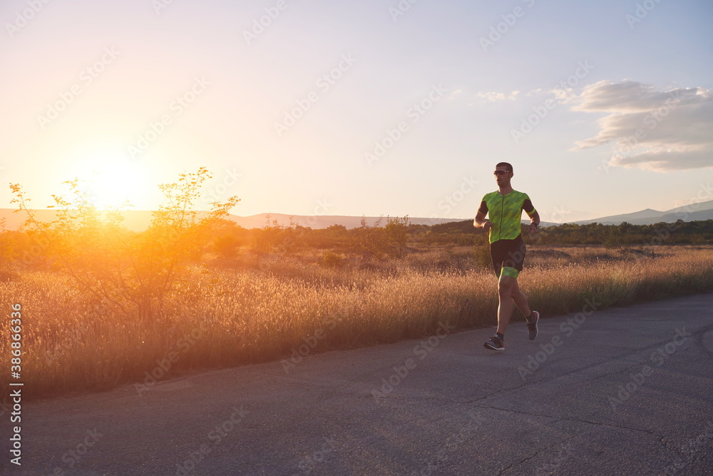 Obraz premium triathlon athlete running on morning trainig