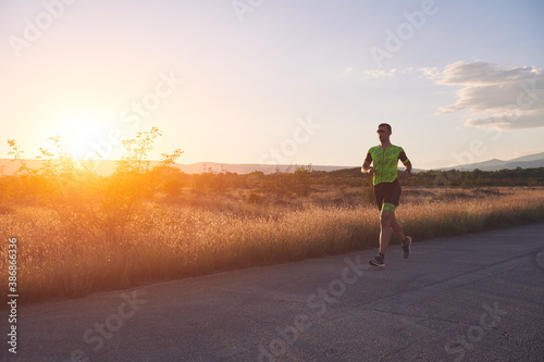 triathlon athlete running on morning trainig