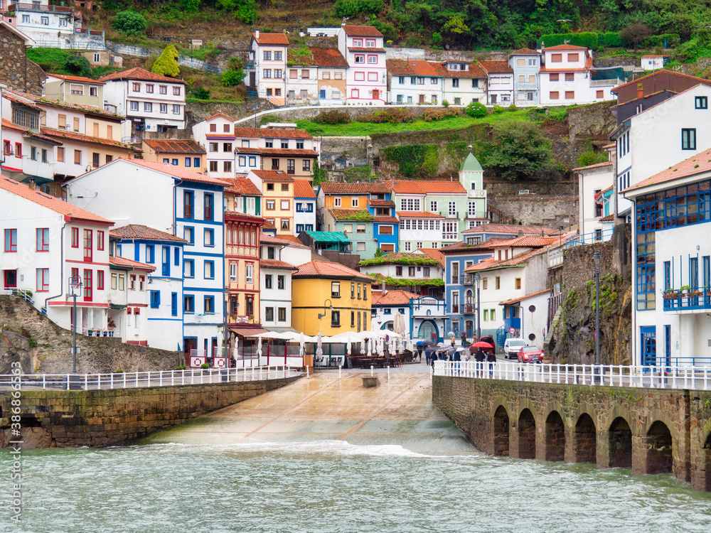 CUDILLERO, SPAIN - OCTOBER 19, 2019: Coastal town of Cudillero with terraced houses, fishing village and tourist destination