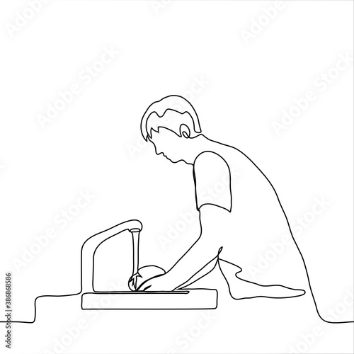 man washes dishes in the sink with his hands. one line drawing a man stands at an open tap with water and washes the dishes in the sink.