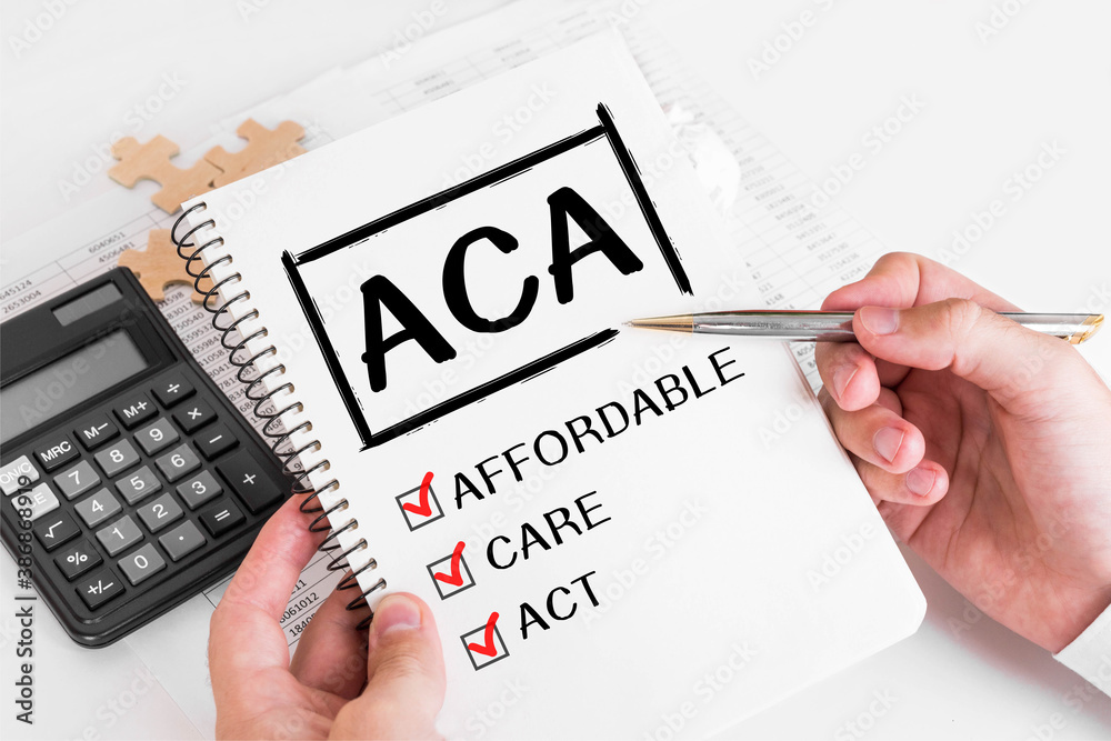 Fotografie Businessman Writing ACA Concepts on his Note