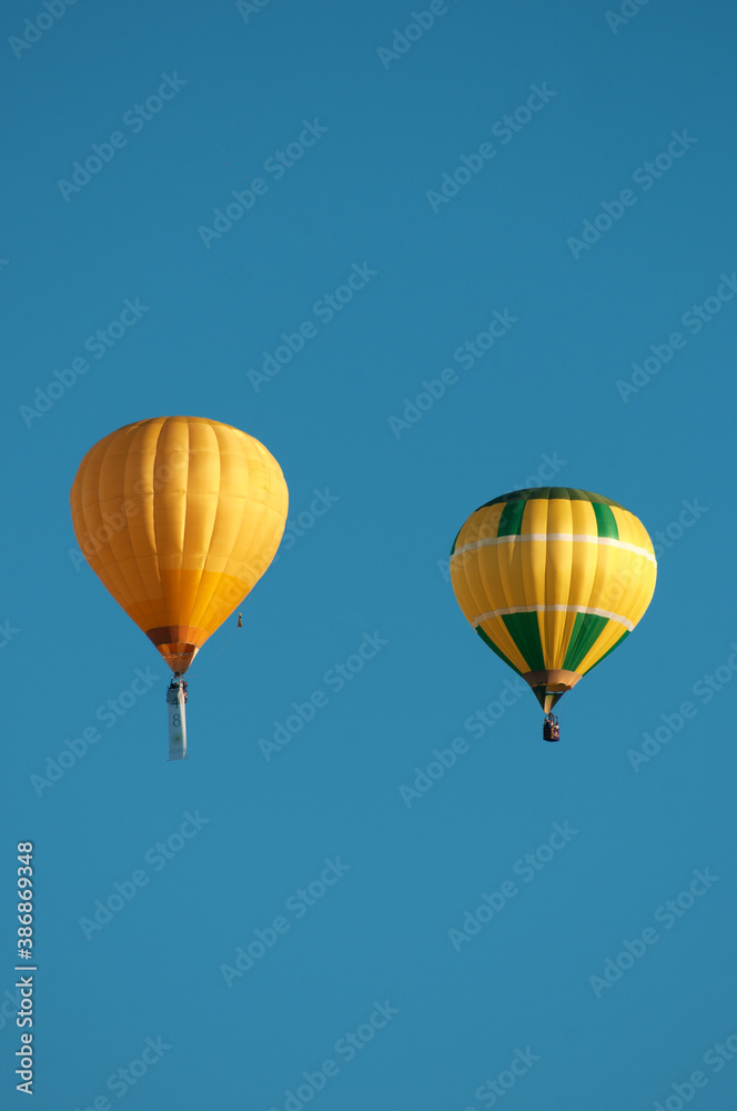 Beautiful hot air balloons ascending.Hot air balloon in the blue sky. Beautiful hot air balloons ascending.Hot air balloon in the blue sky.