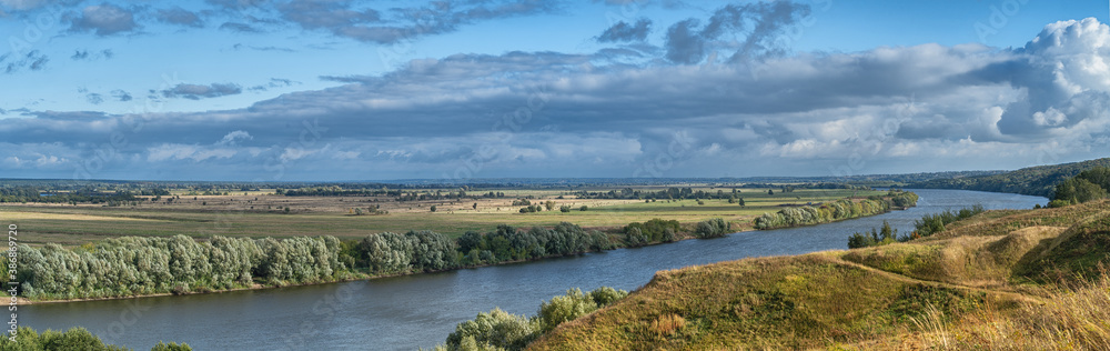 Panorama of the Russian Oka river before sunset on a clear autumn day.