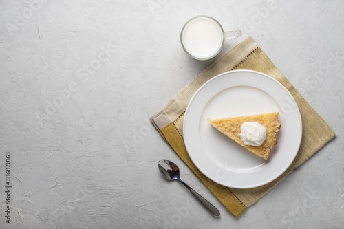 Healthy breakfast made from soft cottage cheese casserole , served with sour cream and  milk.