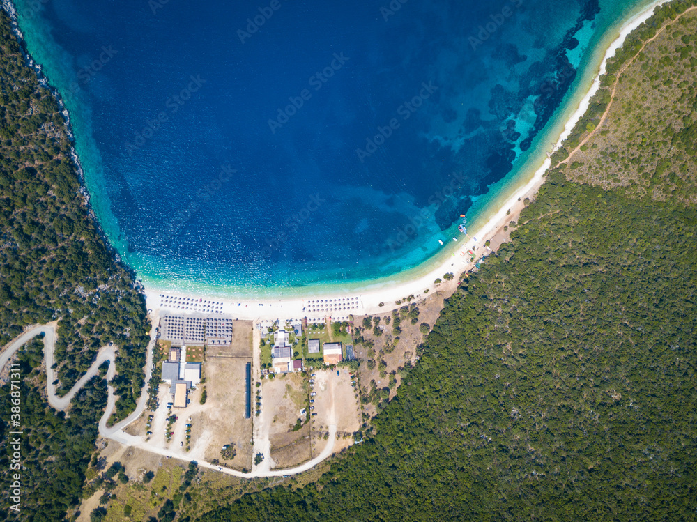 Drone shot directly above crystal clear waters of Antisamos beach in Kefalonia, Greece