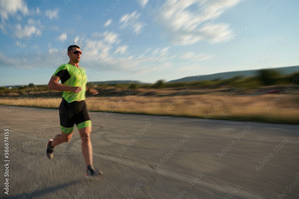 triathlon athlete running on morning trainig triathlon athlete running on morning trainig