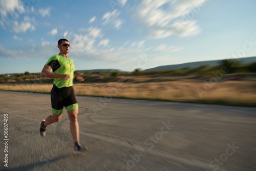 triathlon athlete running on morning trainig