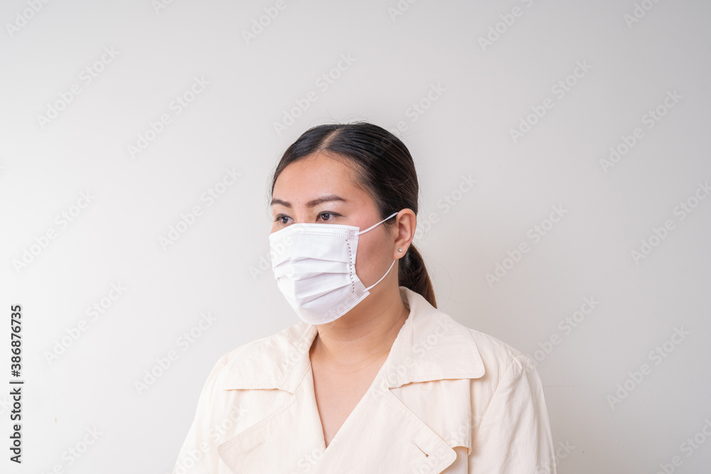 Asian women wearing surgical face mask to prevent flu disease Corona virus Asian women wearing surgical face mask to prevent flu disease Corona virus