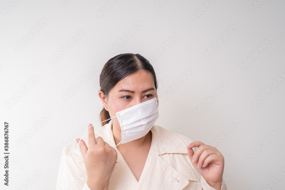 Asian women wearing surgical face mask to prevent flu disease Corona virus Asian women wearing surgical face mask to prevent flu disease Corona virus