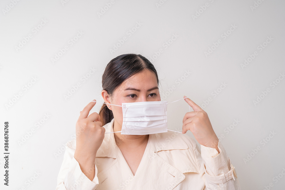 Asian women wearing surgical face mask to prevent flu disease Corona virus Asian women wearing surgical face mask to prevent flu disease Corona virus