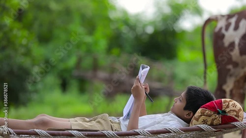 Cute Indian child studying at home.