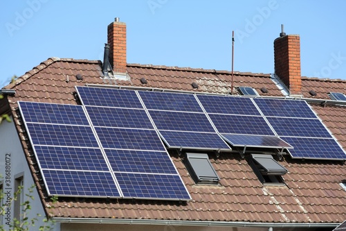 Solar panels on house roof photo