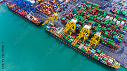 Aerial view port shipping, Container ship port with crane port, Container ship carrying container import and export business logistic and transportation, Cargo freight shipping import export company.