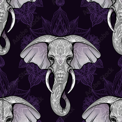 Seamless pattern with ethnic elephant head with mehendi decoration and mandala on violet background. Spiritual Ganesha with tribal decoration. Vector texture for fabric, wallpapers and your creativity