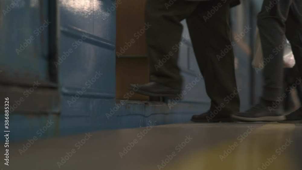 People Entering Subway Train Car, Legs Close-up People Entering Subway Train Car, Legs Close-up