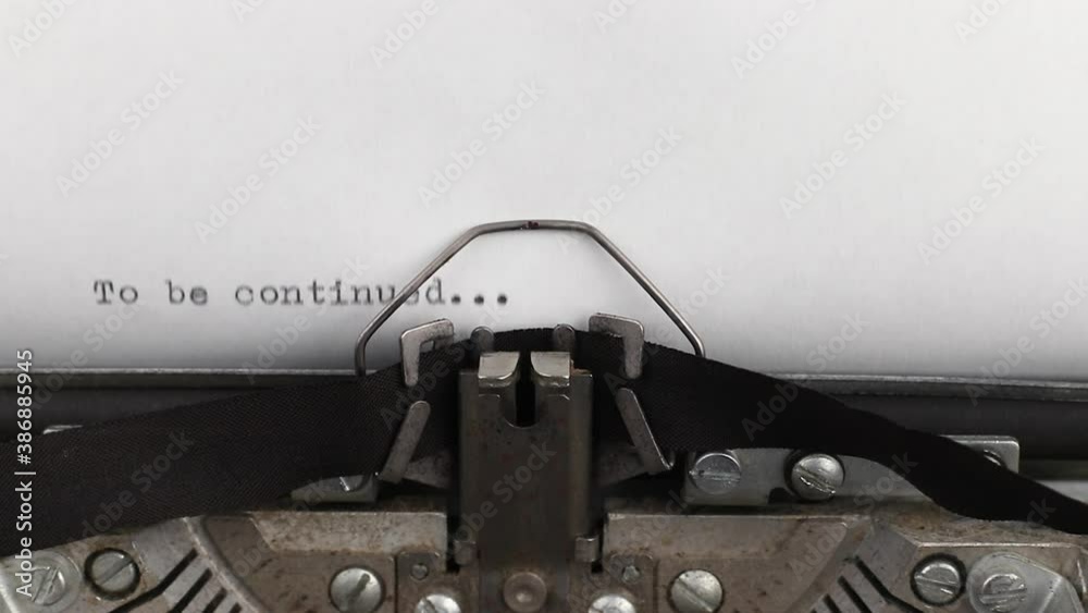 to type a quote to be continued on a vintage and old typewriter close-up
