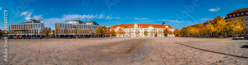 Panoramic view of major Dome square with fountains by Cathedral and Government Office in Magdeburg, Germany, at sunny day and blue sky during Golden Autumn.