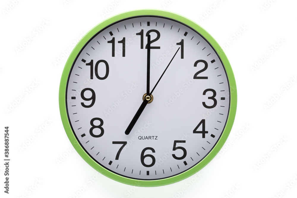 Clipping path included. Clock on white background showing seven o'clock. Clipping path included. Clock on white background showing seven o'clock.