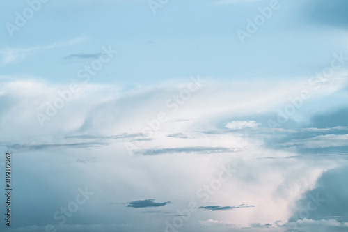 Bright blue evening sky with big cloud for peaceful background or wallpaper