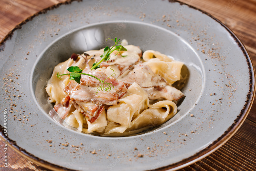 Tasty pasta with sauce on wooden background Tasty pasta with sauce on wooden background