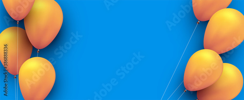 Yellow balloons with threads on blue background.