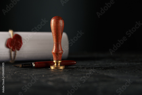 Law, attorney, notary public stamp and pen on desk. law will notary paper lawyer fountain pen seal concept