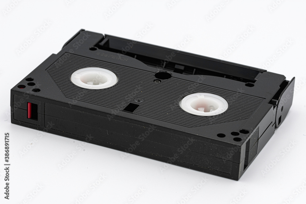 old 8mm magnetic tape on white background old 8mm magnetic tape on white background