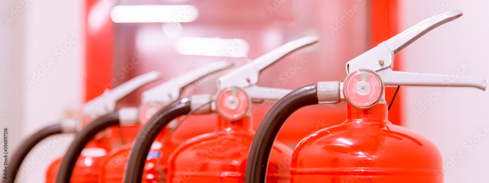 Red tank of fire extinguisher Overview of a powerful industrial fire extinguishing system. Red tank of fire extinguisher Overview of a powerful industrial fire extinguishing system.
