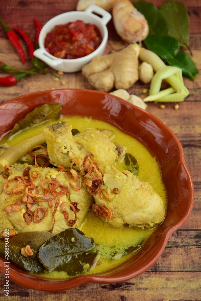 Opor ayam, chicken cooked in coconut milk from Indonesia, from Central Java, served with sambal. Popular dish for lebaran or Eid al-Fitr